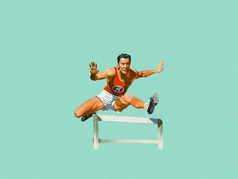 Man jumping over hurdle