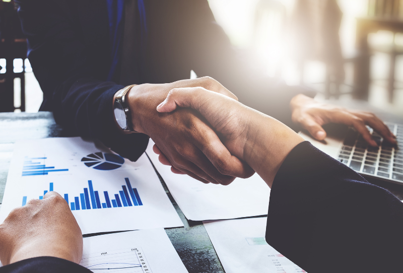 handshake at conference table