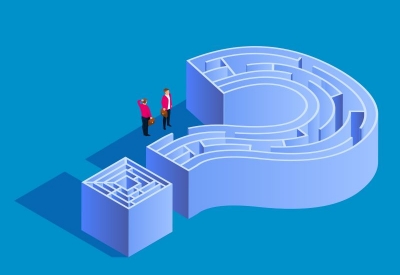Two business people navigating through a maze shaped as a question mark