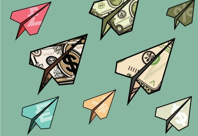 Paper airplanes made out of dollar bills and other currency