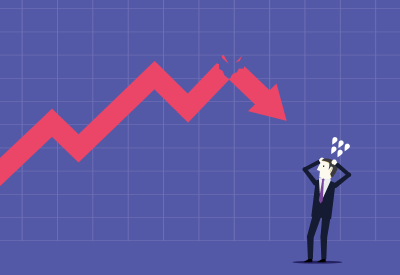 Businessman nervous over arrow on chart falling downward