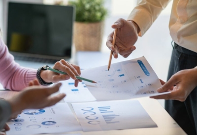 executives at a healthcare facility reviewing capital capacity reports