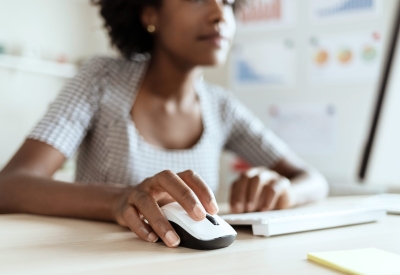 a healthcare finance executive creating a budget on a computer