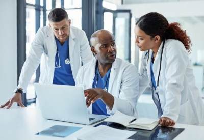 healthcare leaders analyzing and comparing financial data