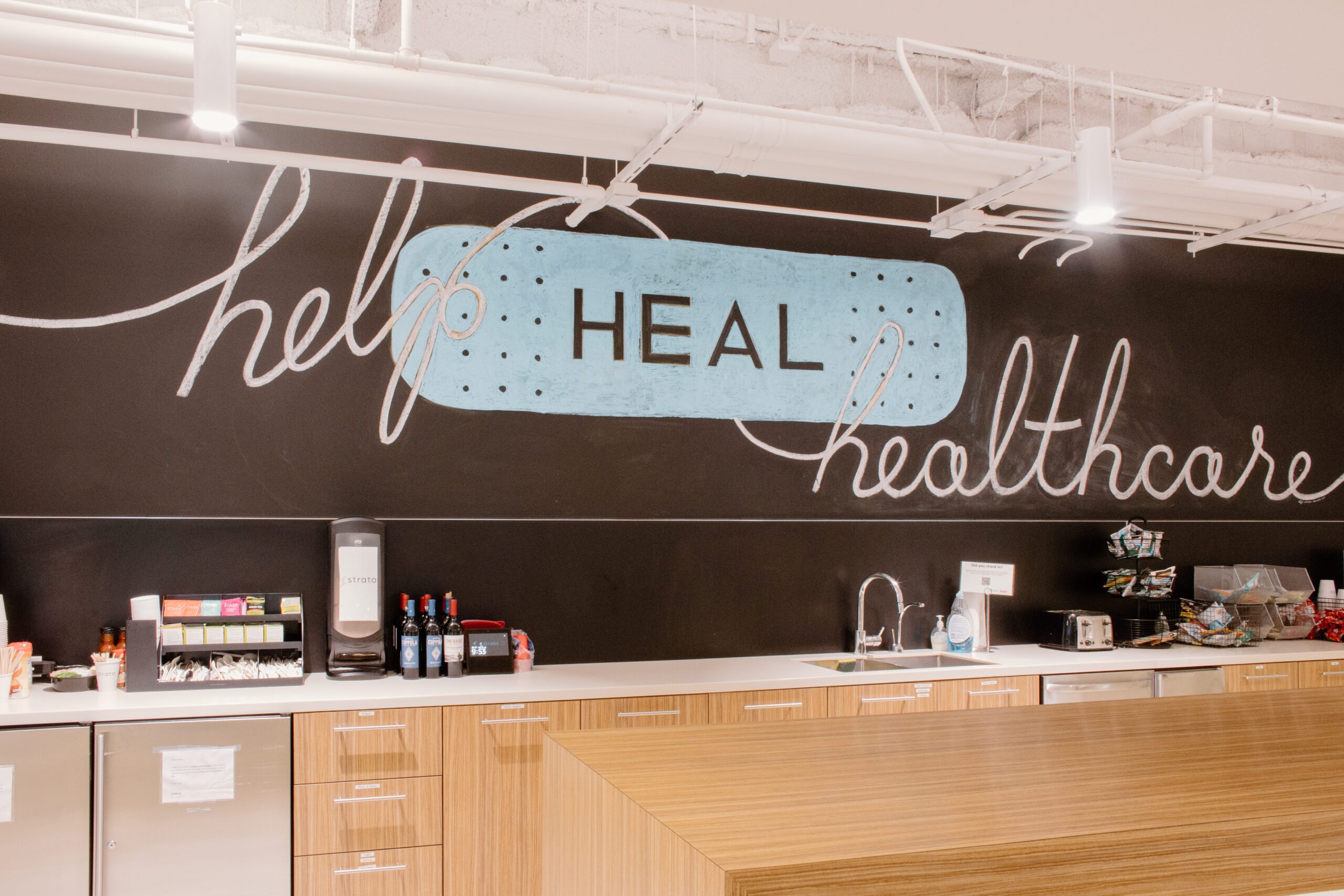 a closeup of the "Help Heal Healthcare" sign at the Strata office